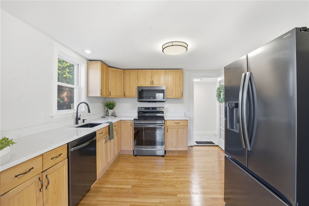 207 Mendon Road Cumberland, RI 02864 - Photo 6 of 22 Kitchen with side entry to the driveway