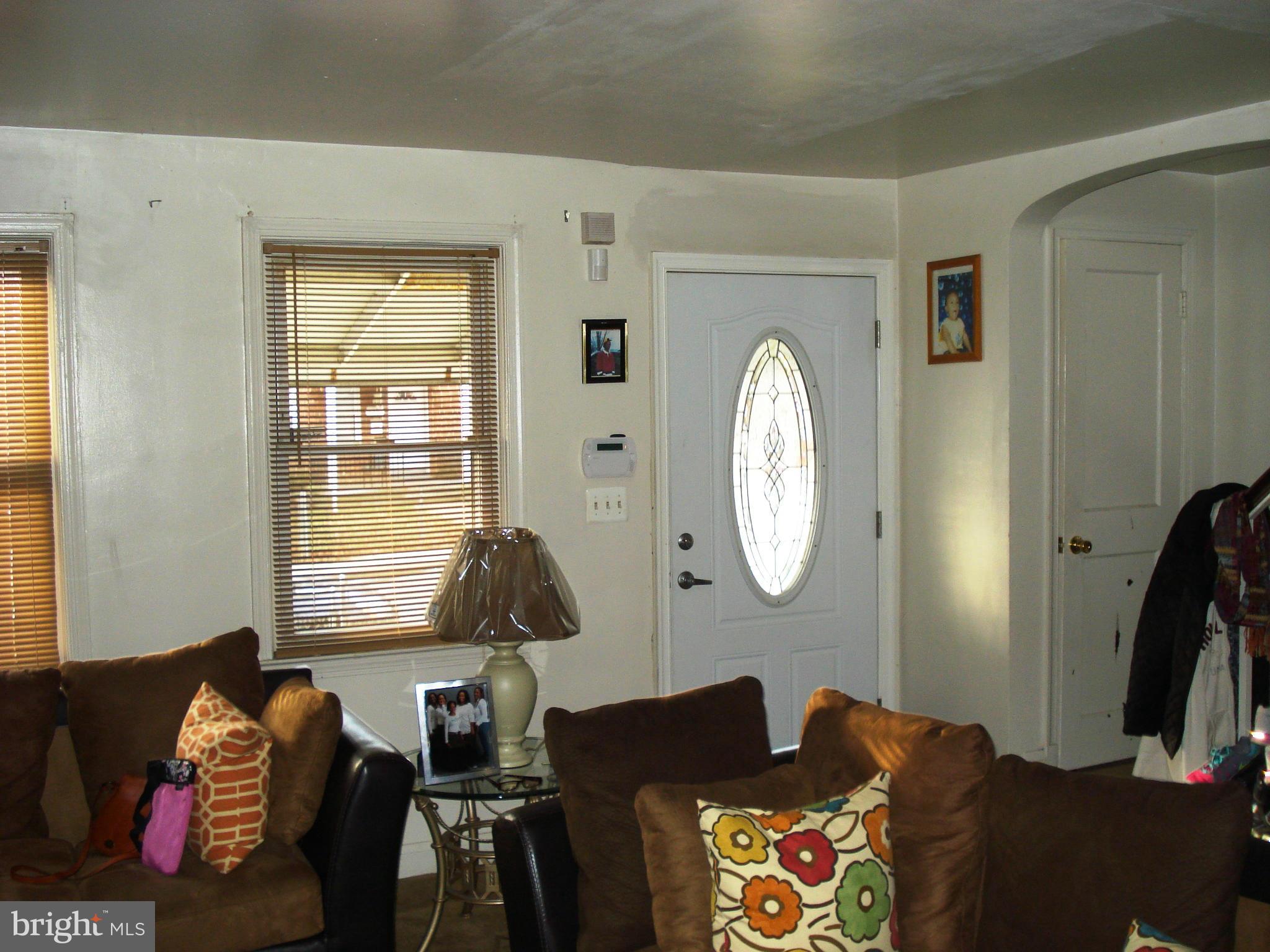 3906 Flowerton Road Baltimore, MD 21229 - Photo 3 of 27 a living room with furniture and a window