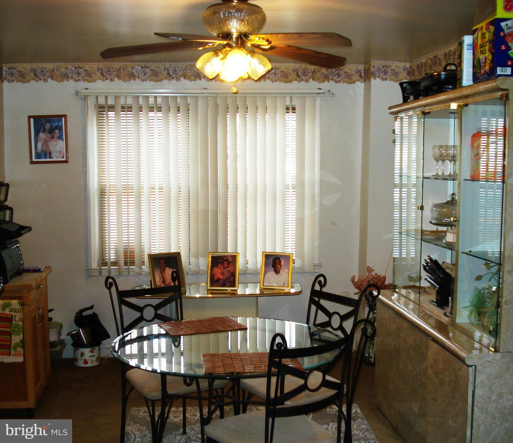 3906 Flowerton Road Baltimore, MD 21229 - Photo 8 of 27 a view of a dining room with furniture window and outside view