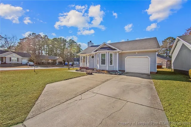 a view of an house with outdoor space and sitting area