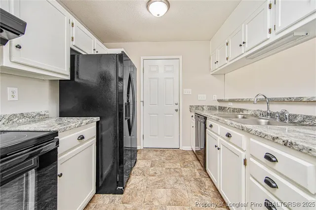 a bathroom with a sink and a granite counter tops