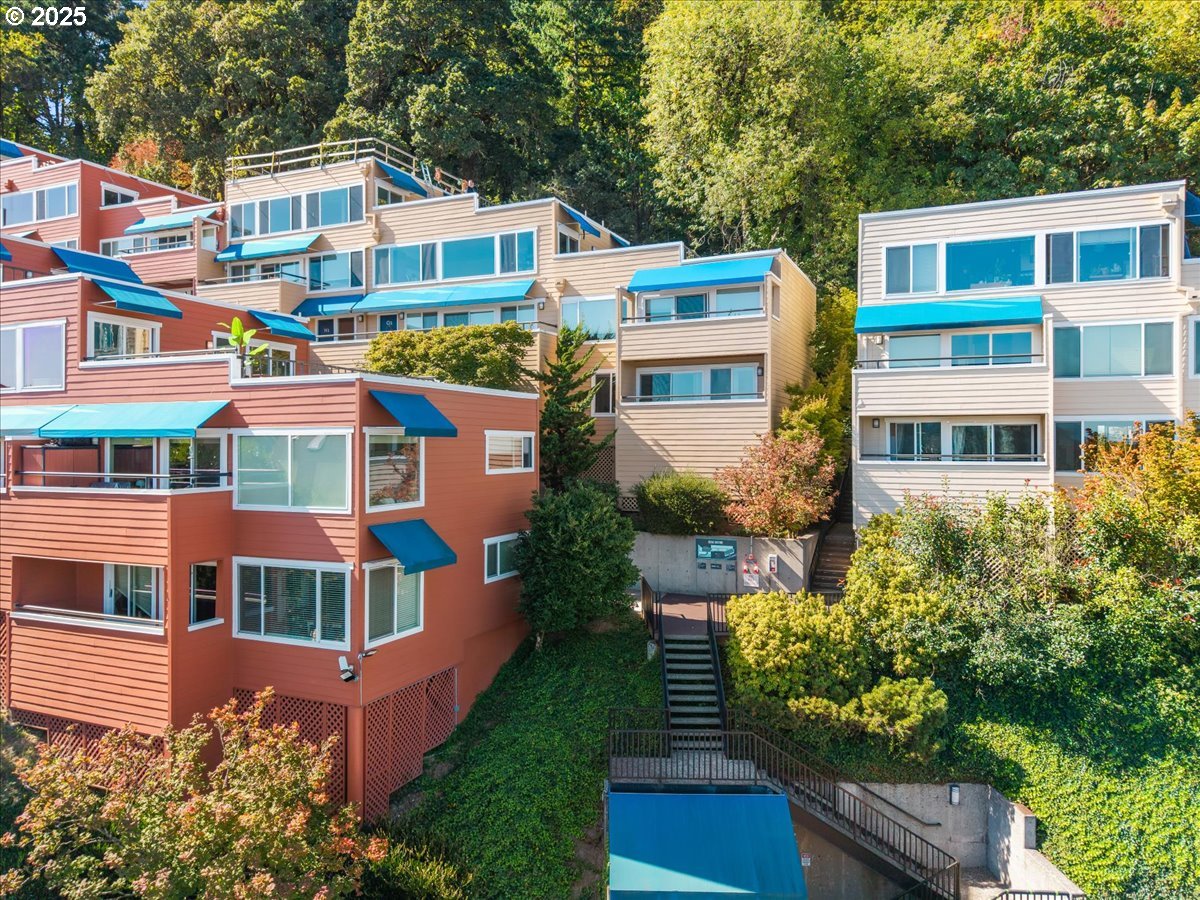 a front view of a residential apartment building with a yard