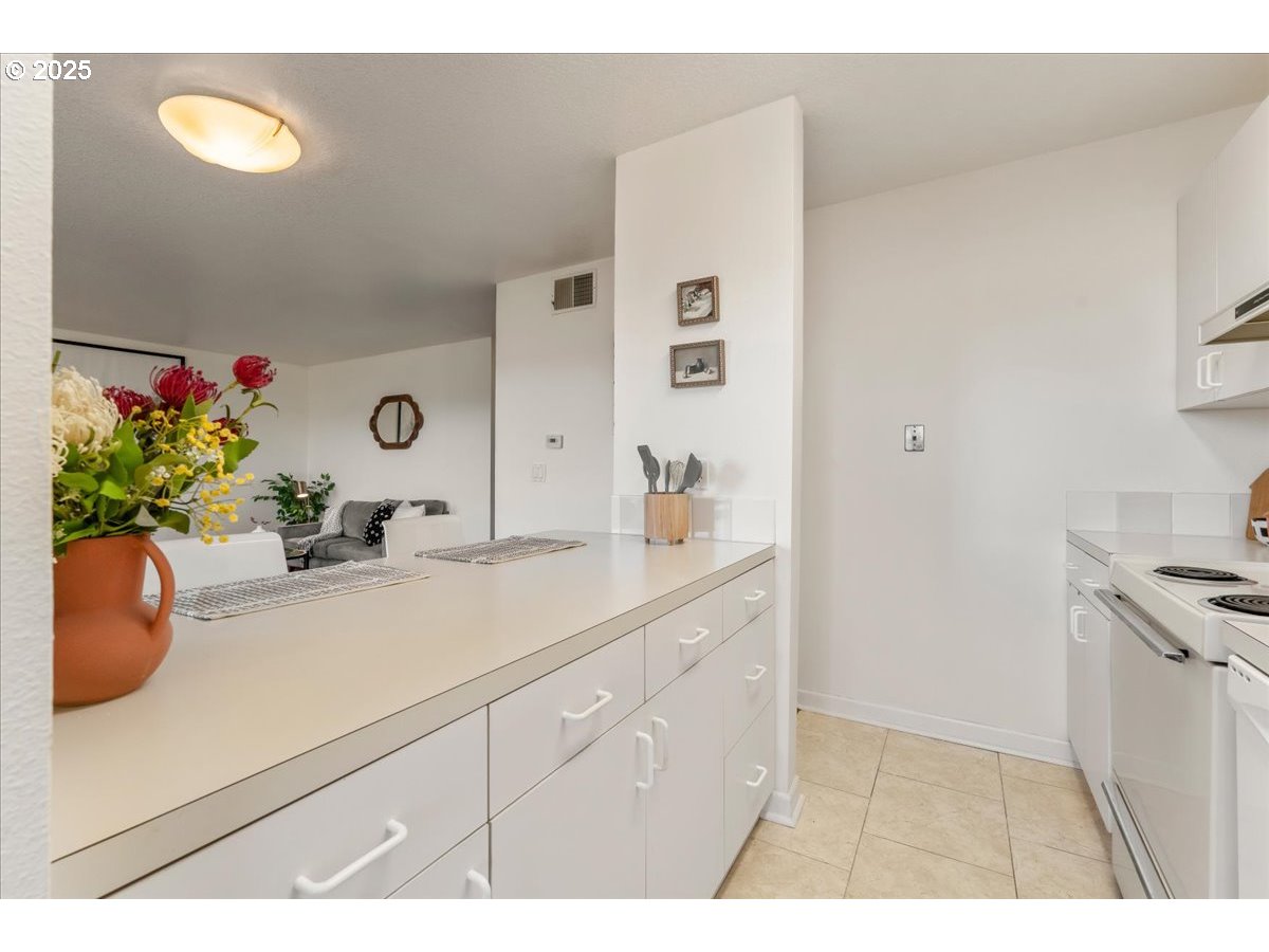 3515 Southwest Barbur Boulevard, Unit P1 Portland, OR 97239 - Photo 14 of 35 a bathroom with a sink and a mirror