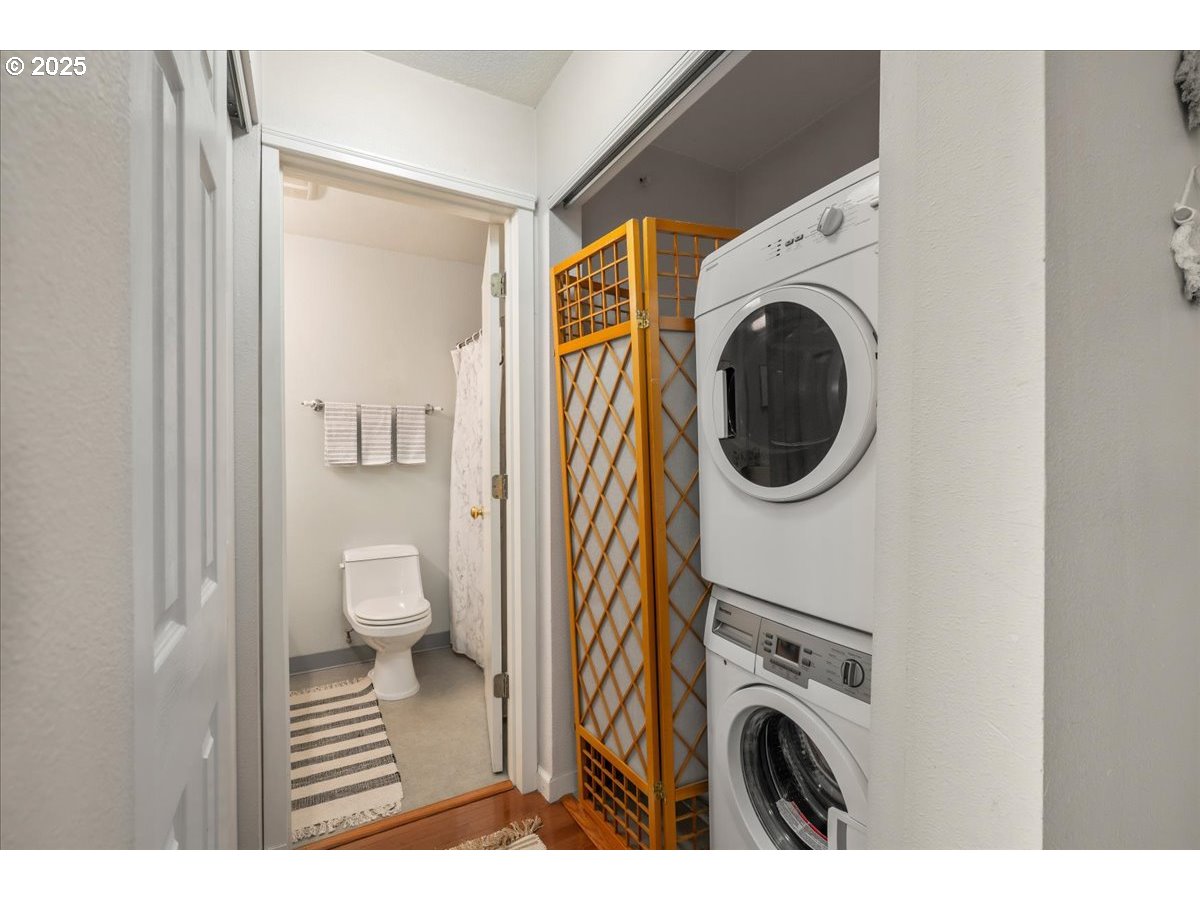 3515 Southwest Barbur Boulevard, Unit P1 Portland, OR 97239 - Photo 17 of 35 a view of a bathroom with washing machine and sink