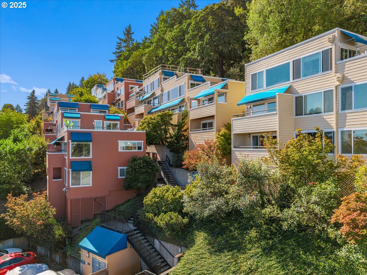 3515 Southwest Barbur Boulevard, Unit P1 Portland, OR 97239 - Photo 27 of 35 a aerial view of a house with a yard and potted plants