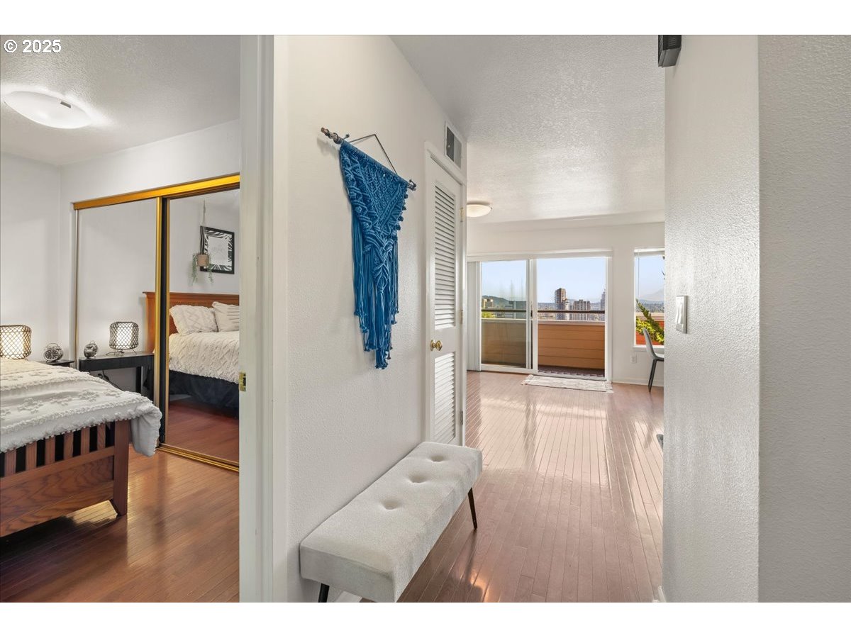 3515 Southwest Barbur Boulevard, Unit P1 Portland, OR 97239 - Photo 4 of 35 a hallway with a furniture and a large window