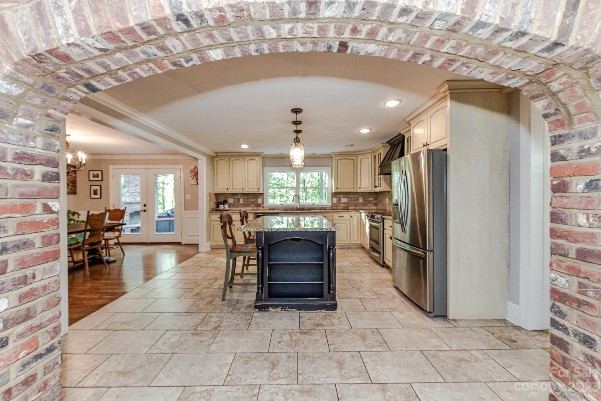1050 Ben Black Road Midland, NC 28107 - Photo 11 of 48 a kitchen with refrigerator and chairs