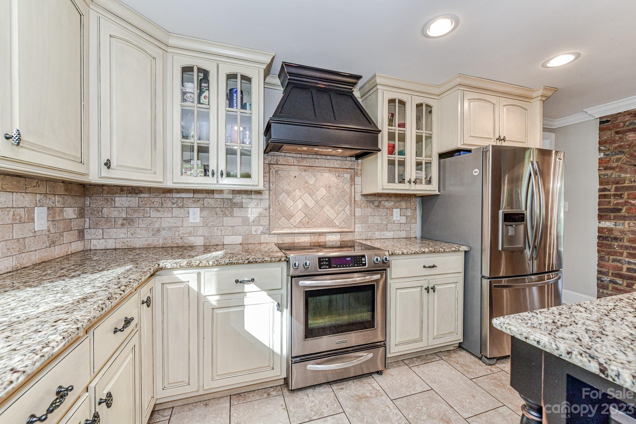 1050 Ben Black Road Midland, NC 28107 - Photo 13 of 48 a kitchen with granite countertop a stove sink and refrigerator