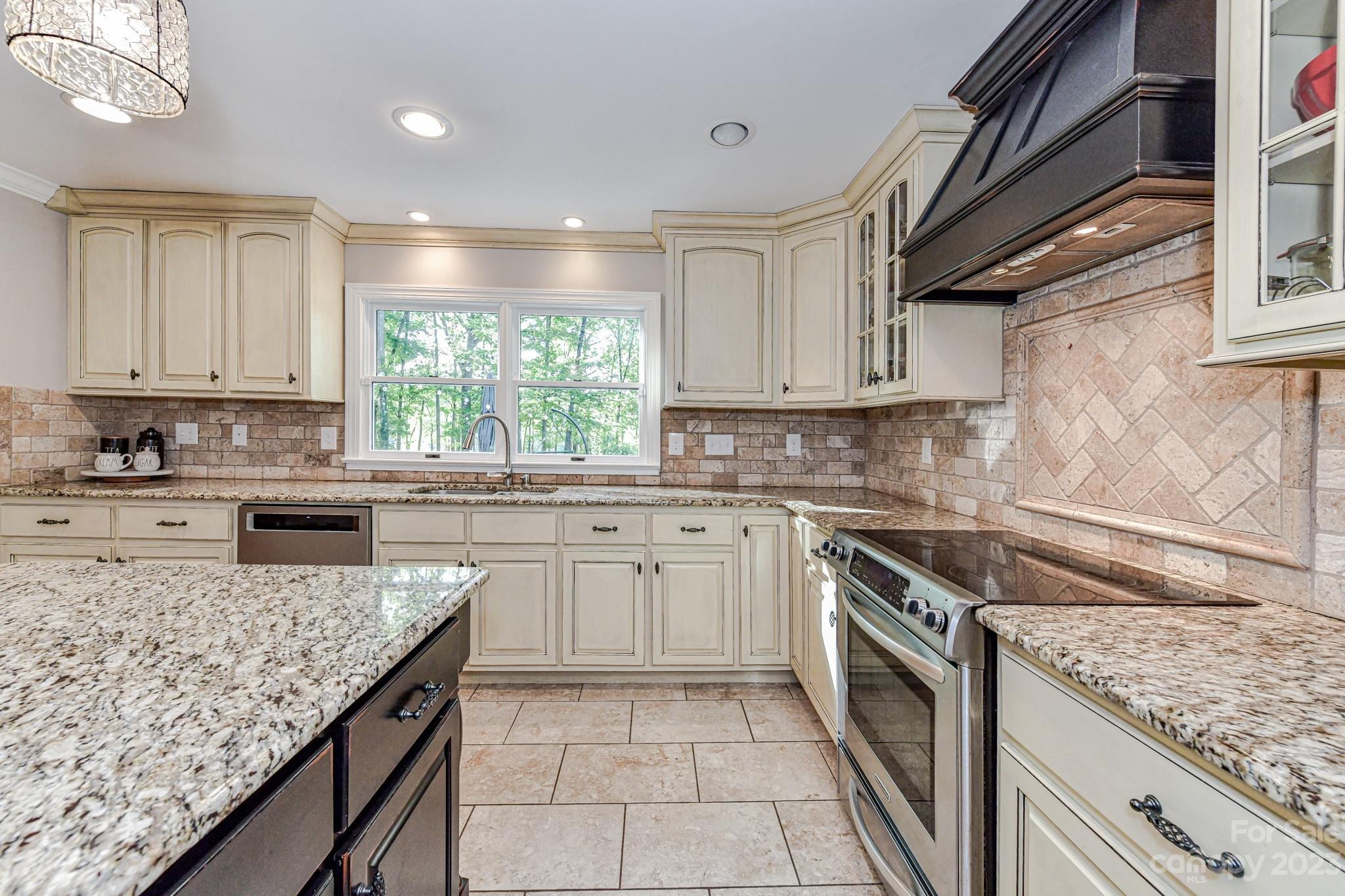 1050 Ben Black Road Midland, NC 28107 - Photo 15 of 48 a kitchen with a stove sink and cabinets
