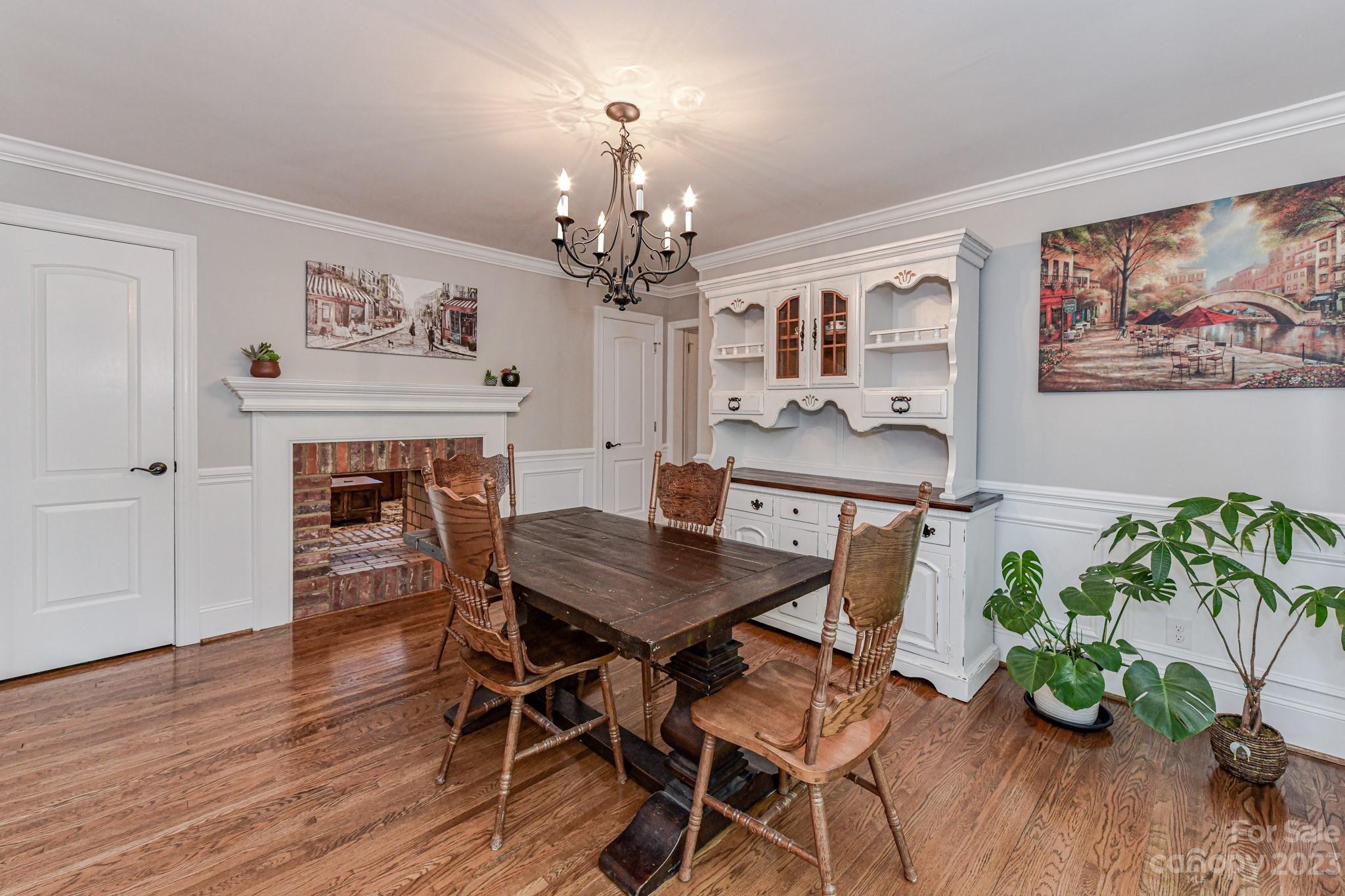 1050 Ben Black Road Midland, NC 28107 - Photo 17 of 48 a view of a dining room with furniture wooden floor and a chandelier