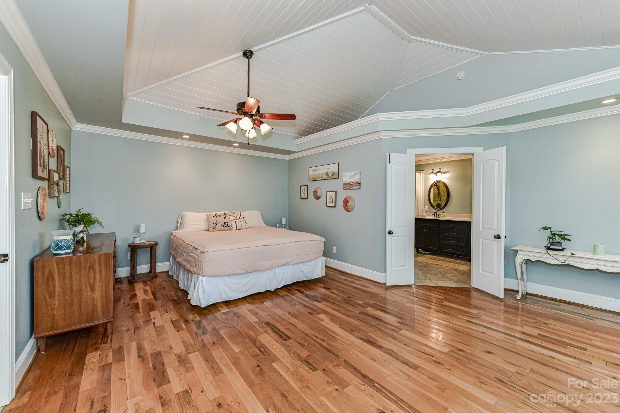 1050 Ben Black Road Midland, NC 28107 - Photo 19 of 48 a bedroom with a bed and wooden floor