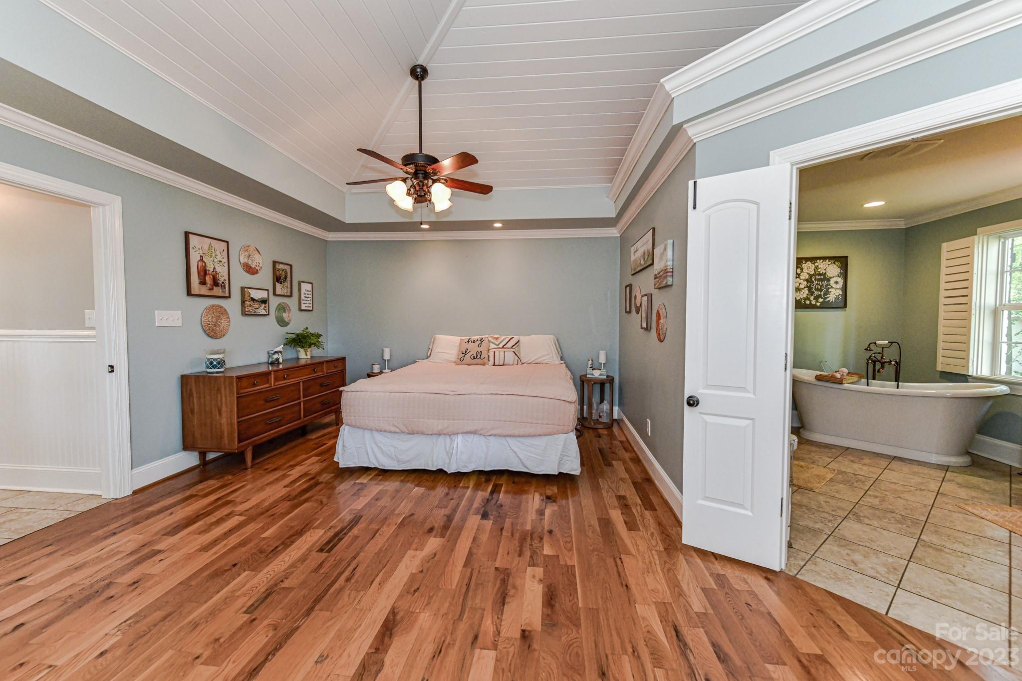 1050 Ben Black Road Midland, NC 28107 - Photo 20 of 48 a spacious bedroom with a bed and wooden floor