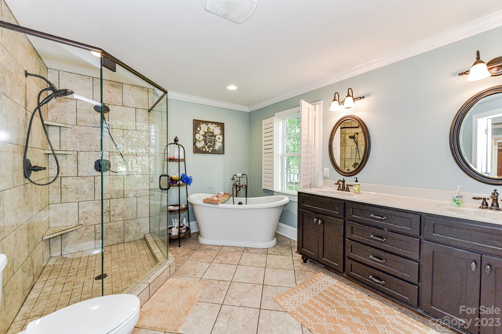 1050 Ben Black Road Midland, NC 28107 - Photo 24 of 48 a bathroom with a toilet sink and mirror