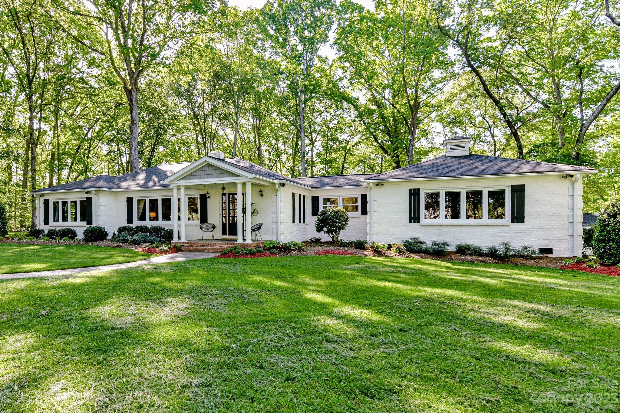 1050 Ben Black Road Midland, NC 28107 - Photo 3 of 48 a front view of a house with a garden