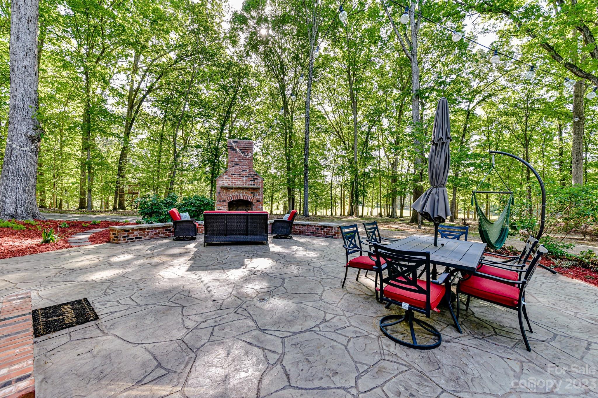 1050 Ben Black Road Midland, NC 28107 - Photo 31 of 48 a view of a patio with table and chairs and potted plants