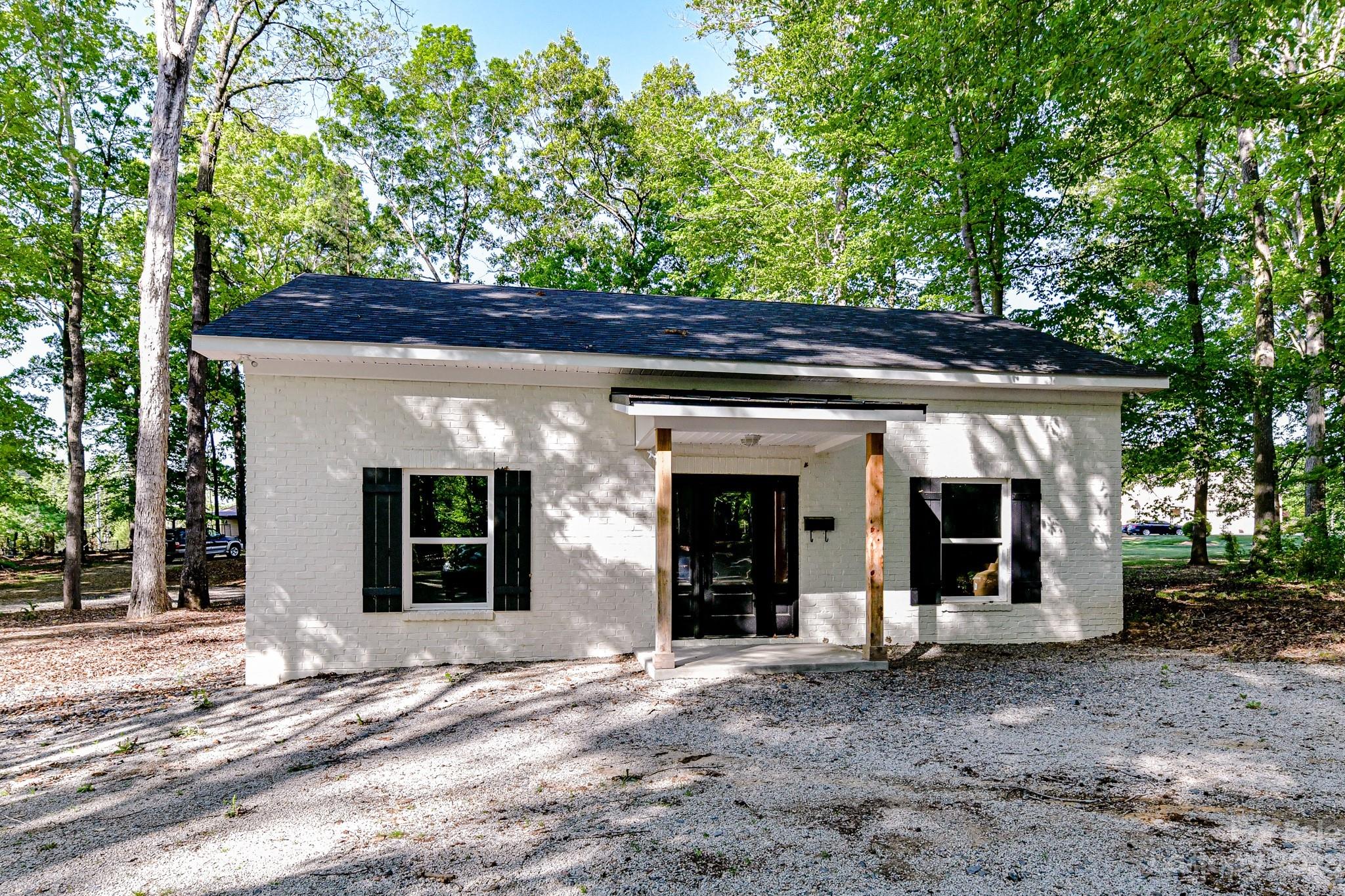 1050 Ben Black Road Midland, NC 28107 - Photo 37 of 48 a view of a house with a large tree
