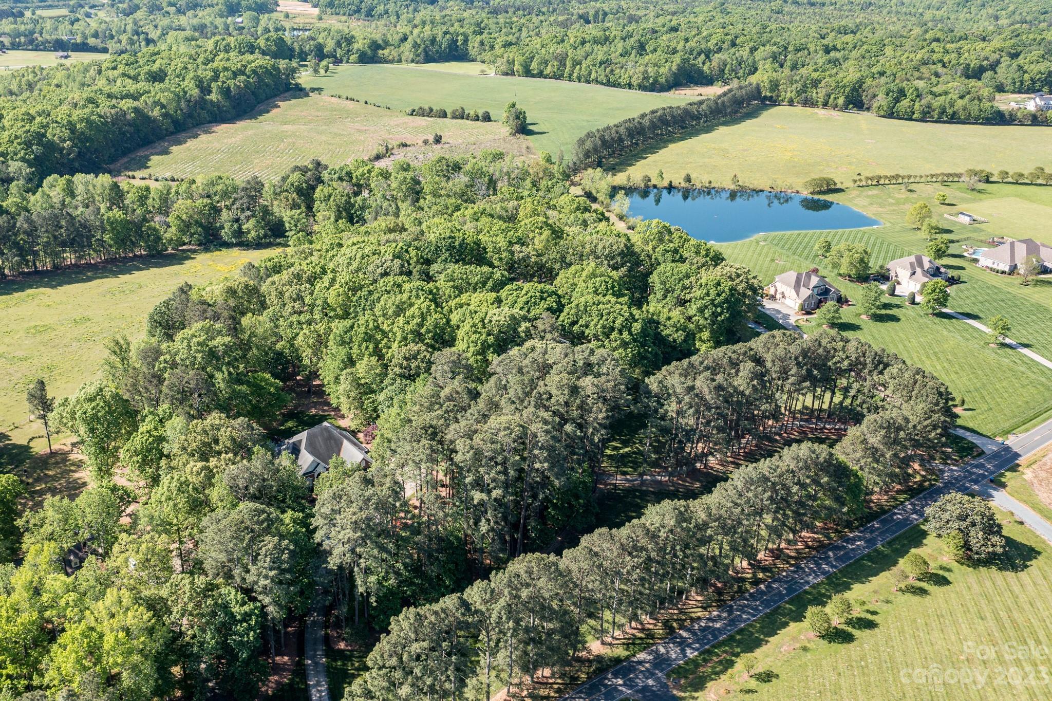 1050 Ben Black Road Midland, NC 28107 - Photo 43 of 48 a view of a lake with a house