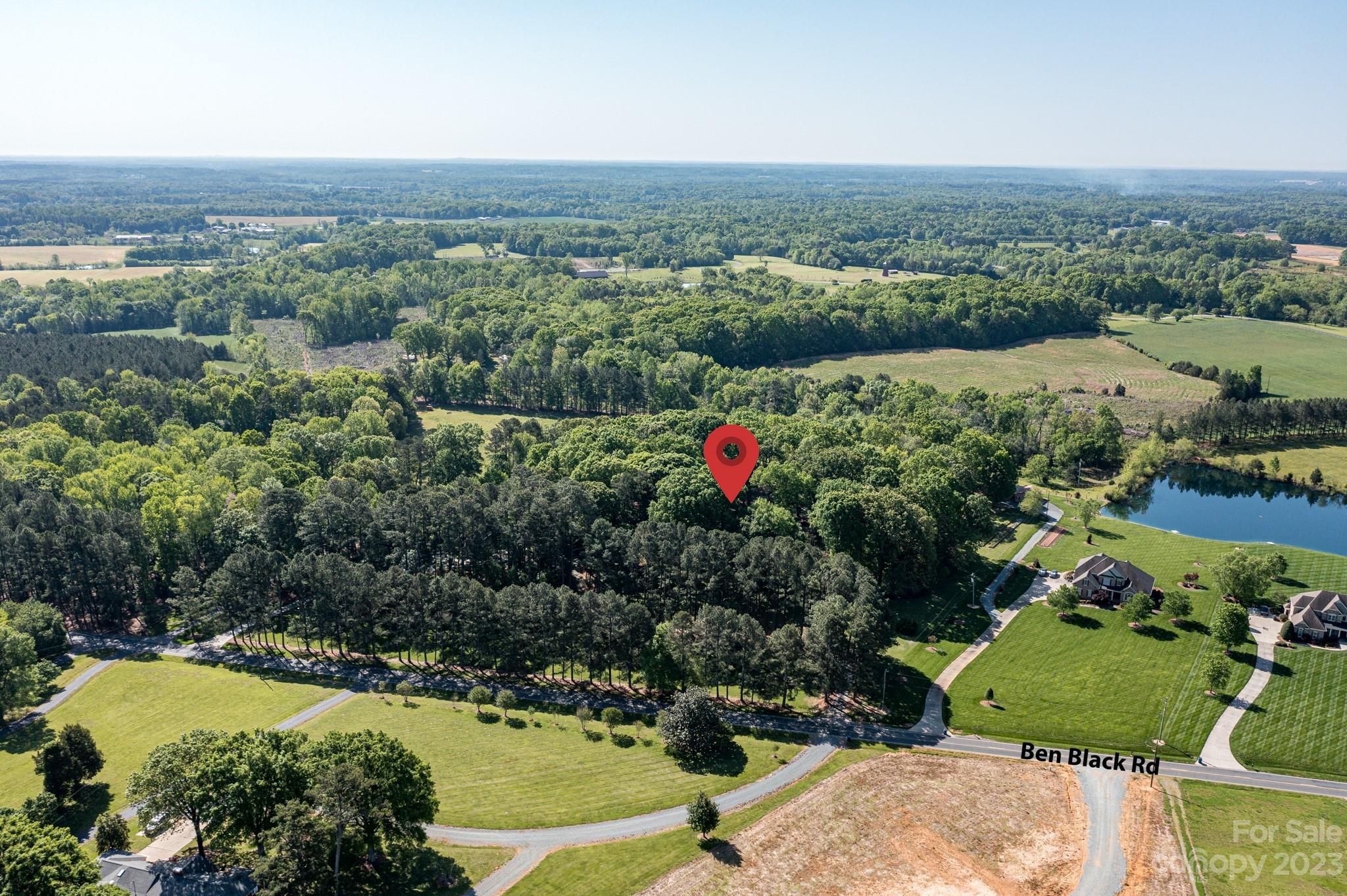 1050 Ben Black Road Midland, NC 28107 - Photo 44 of 48 an aerial view of a houses with a yard and lake view