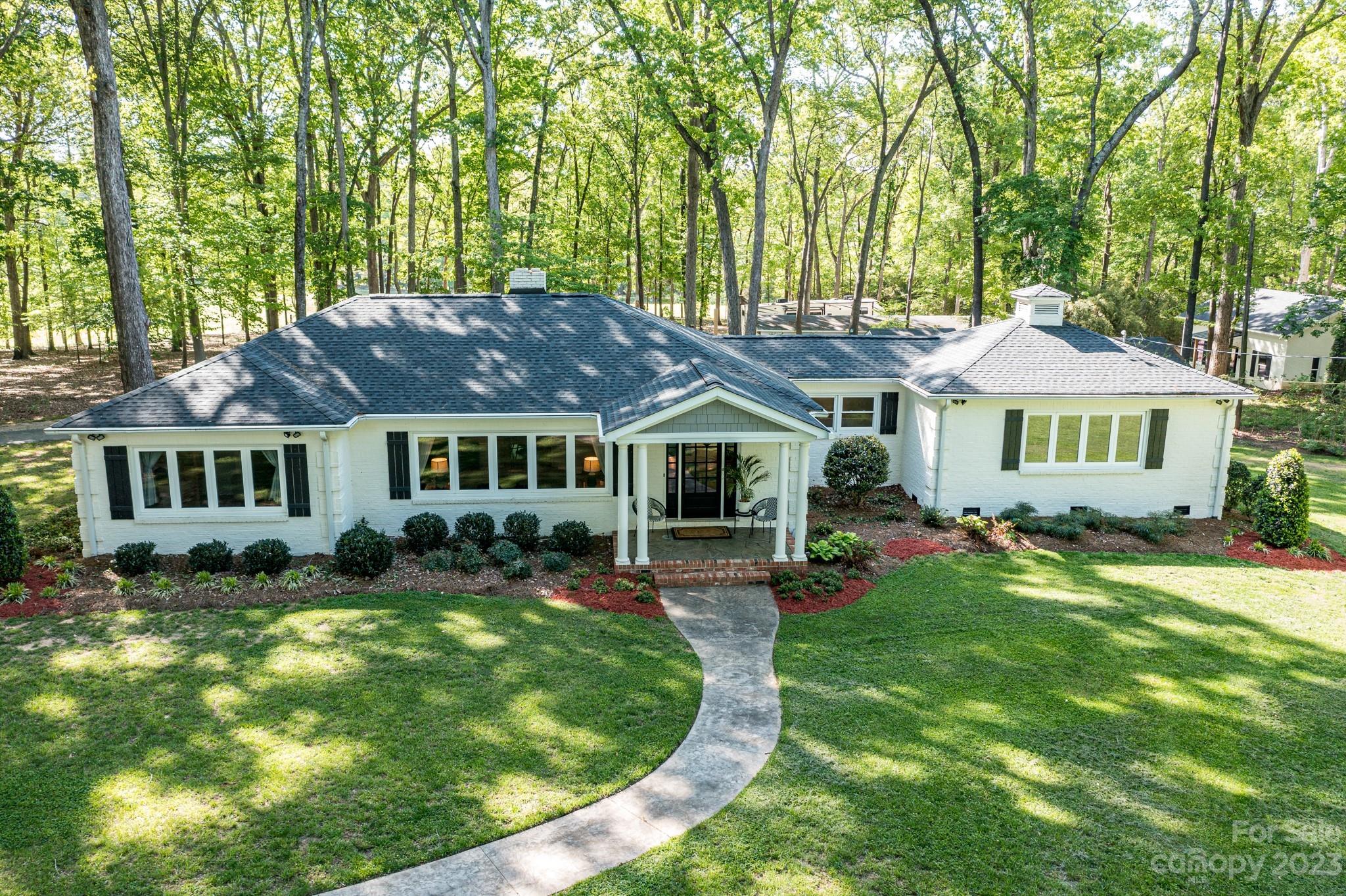 1050 Ben Black Road Midland, NC 28107 - Photo 46 of 48 a front view of a house with a yard table and chairs