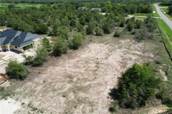 an aerial view of residential house with outdoor space