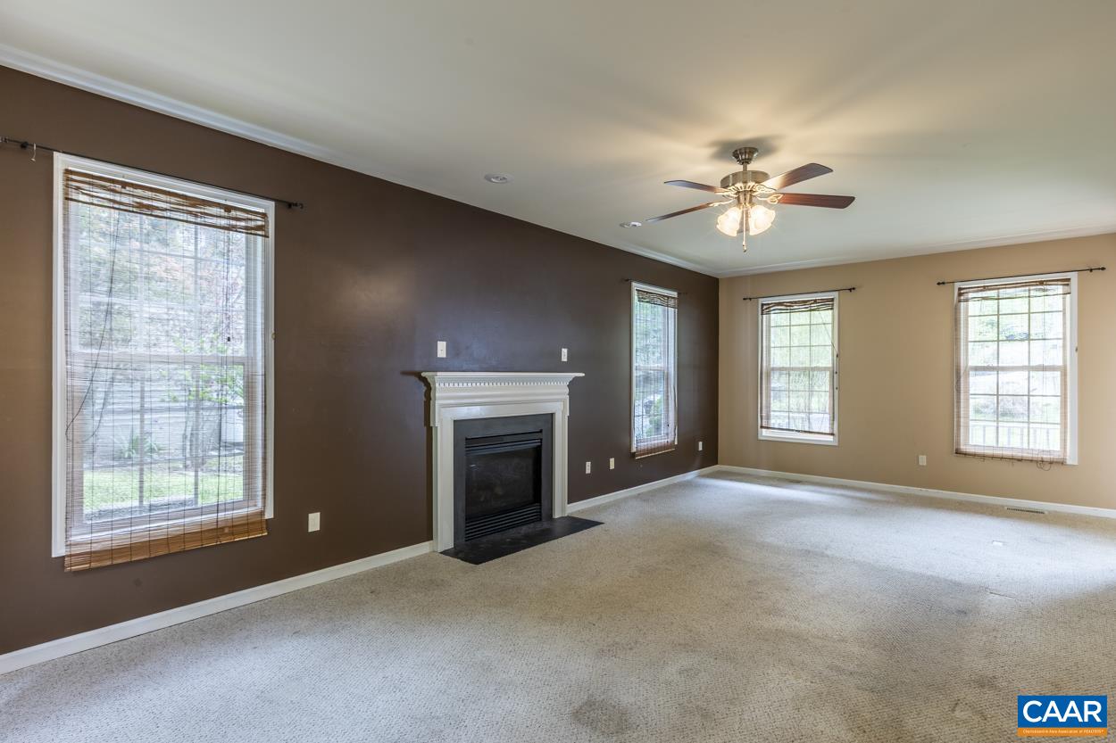 28 Xebec Road Palmyra, VA 22963 - Photo 12 of 34 a view of an empty room with a fireplace and a window