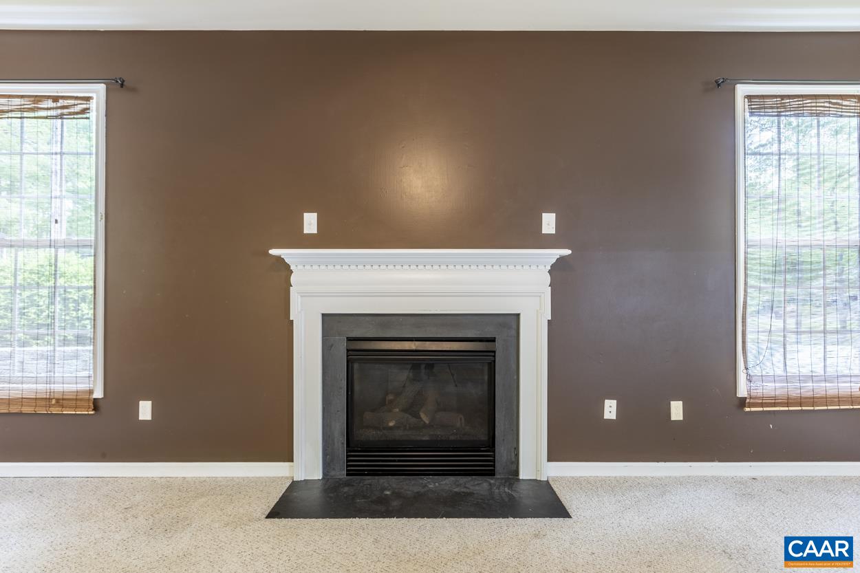 28 Xebec Road Palmyra, VA 22963 - Photo 14 of 34 a living room with a fireplace and a window