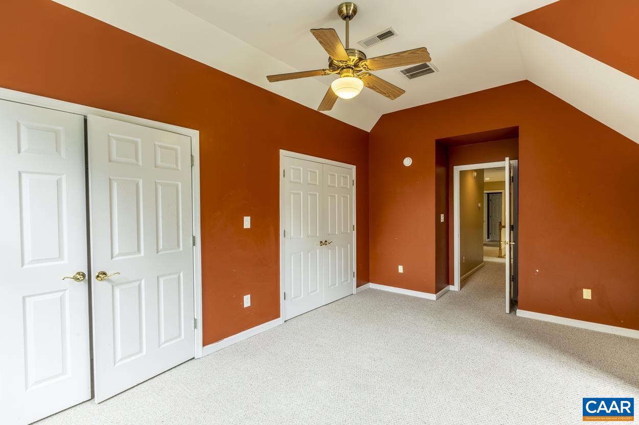28 Xebec Road Palmyra, VA 22963 - Photo 21 of 34 an empty room with closet and a chandelier fan