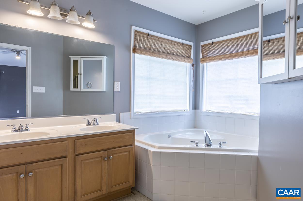 28 Xebec Road Palmyra, VA 22963 - Photo 26 of 34 a bathroom with a sink double vanity and a mirror