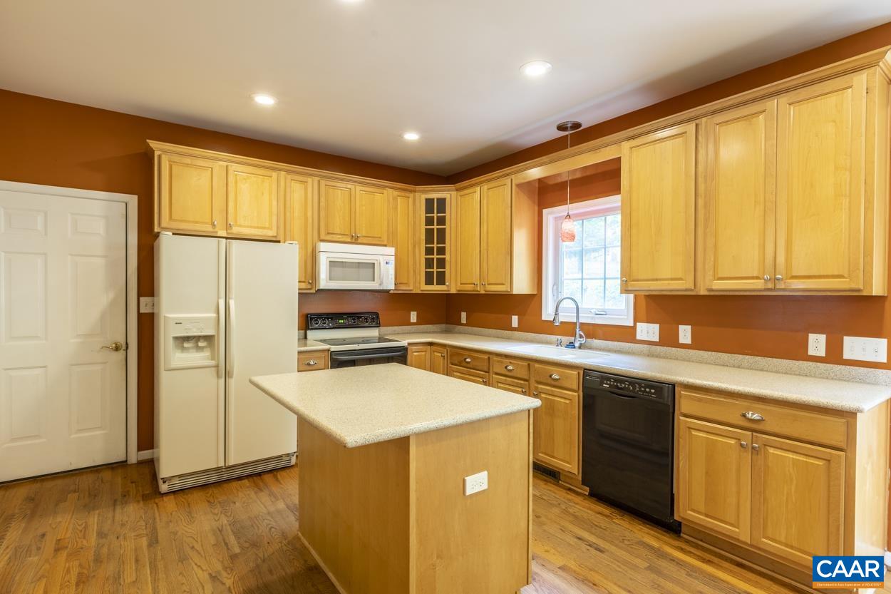 28 Xebec Road Palmyra, VA 22963 - Photo 4 of 34 a kitchen with stainless steel appliances granite countertop a refrigerator a sink dishwasher a stove and white countertops with wooden floor