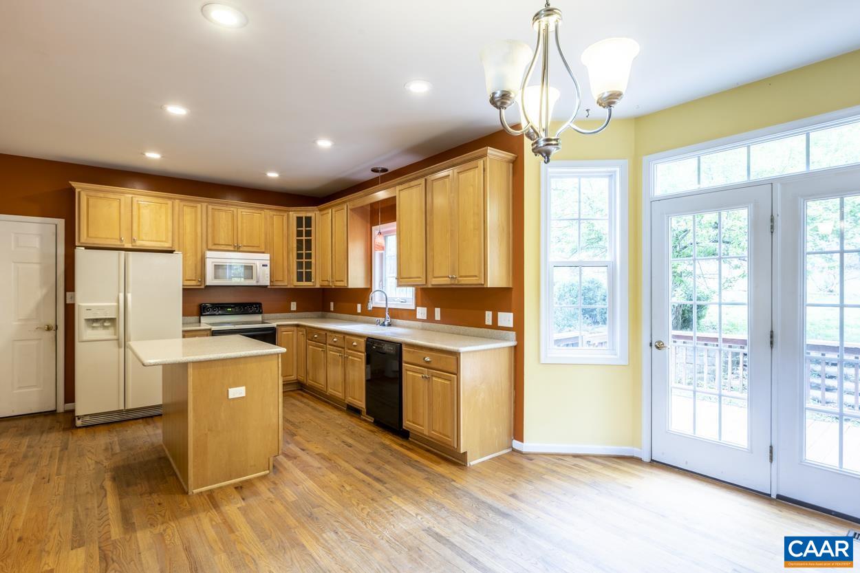 28 Xebec Road Palmyra, VA 22963 - Photo 5 of 34 a kitchen with stainless steel appliances granite countertop a refrigerator a sink dishwasher a stove and white cabinets with wooden floor