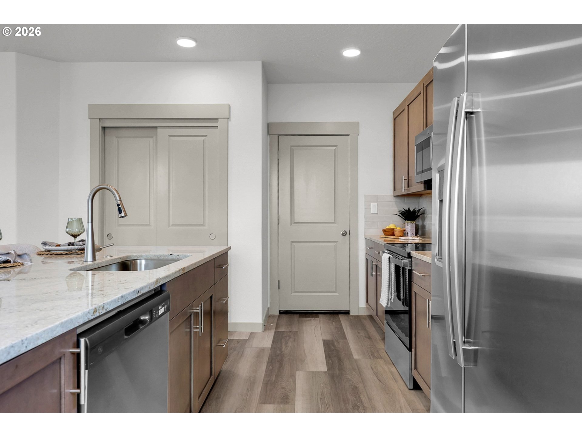 1018 South 52nd Street Springfield, OR 97478 - Photo 7 of 13 a kitchen with a sink and refrigerator