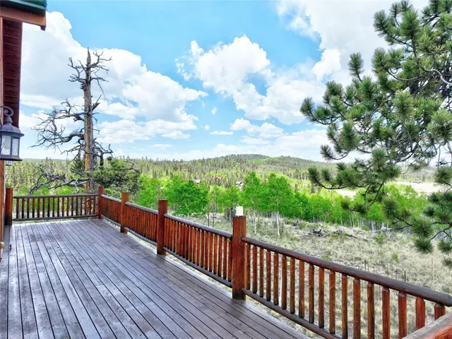 a view of a balcony with wooden floor