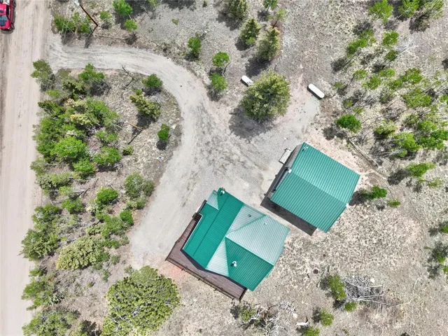 an aerial view of a house with a yard and garden