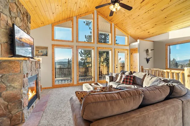 a living room with furniture fireplace and a flat screen tv