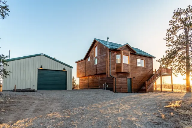 a view of a house with a yard and garage