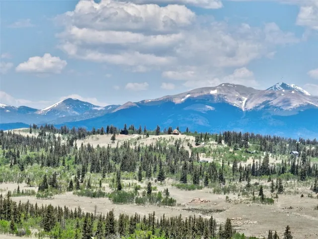 a view of a yard and mountain