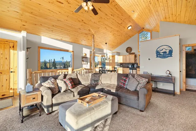 a living room with furniture and a clock