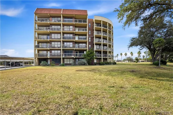 a kitchen with stainless steel appliances granite countertop a refrigerator sink and stove