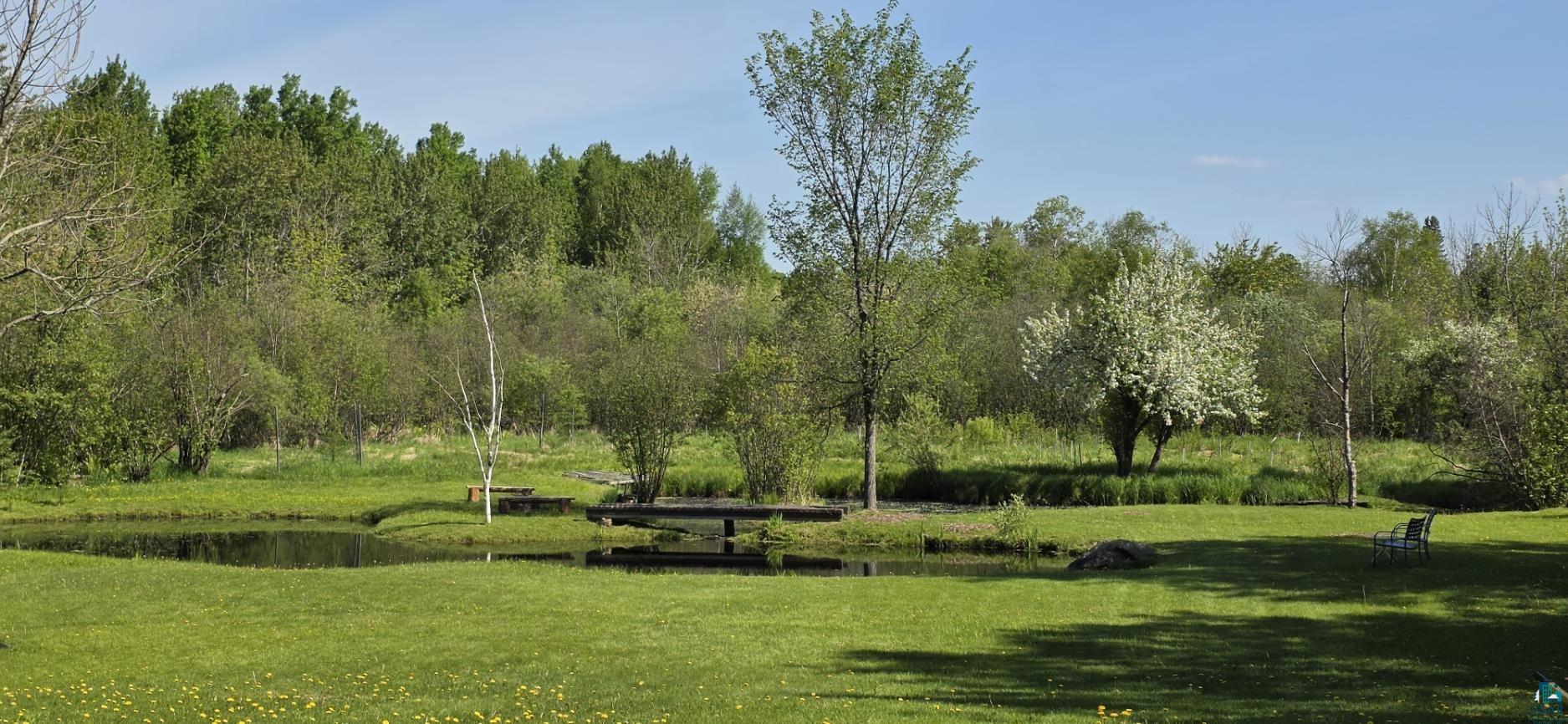 5195 Lavaque Junction Road Hermantown, MN 55811 - Photo 55 of 66 Expansive green lawn bordering a tranquil pond