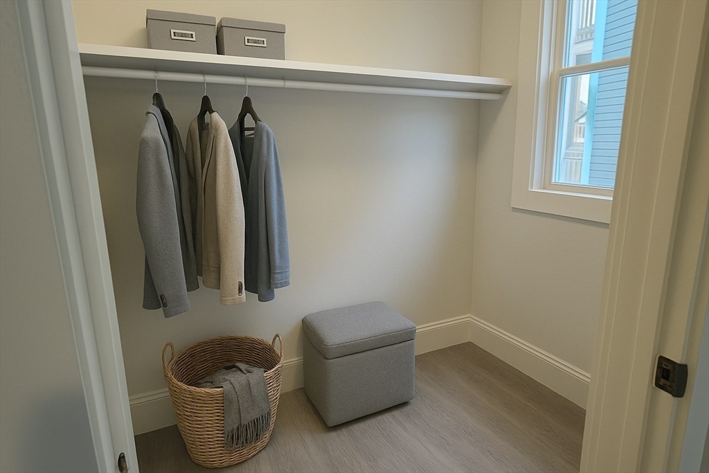 22 Browning Avenue, Unit 2 Boston, MA 02124 - Photo 5 of 10 a room with a chair and a window