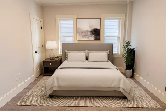 a bedroom with a bed and window