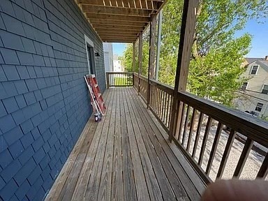 22 Browning Avenue, Unit 2 Boston, MA 02124 - Photo 9 of 10 a view of balcony with wooden floor and outdoor seating