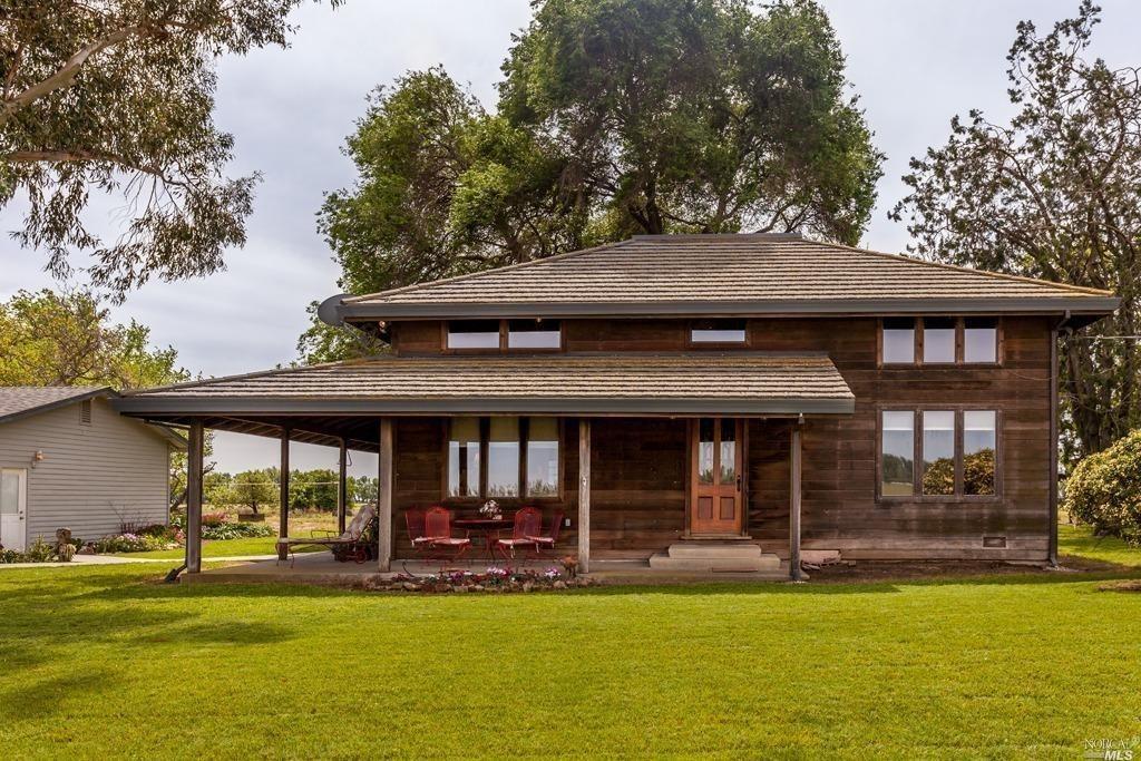 6858 Lewis Road Dixon, CA 95620 - Photo 1 of 1 This home was constructed with materials from the original family farm house. The stone coated metal roof ties in nicely with redwood siding.