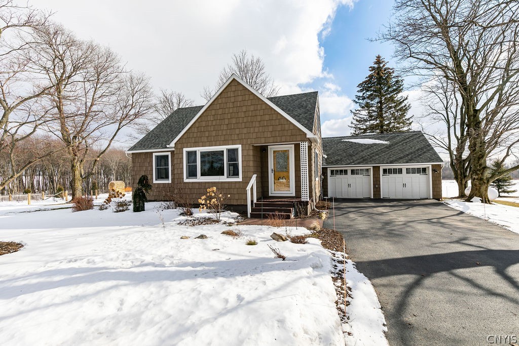 Charming updated farmhouse with 2 car attached gar