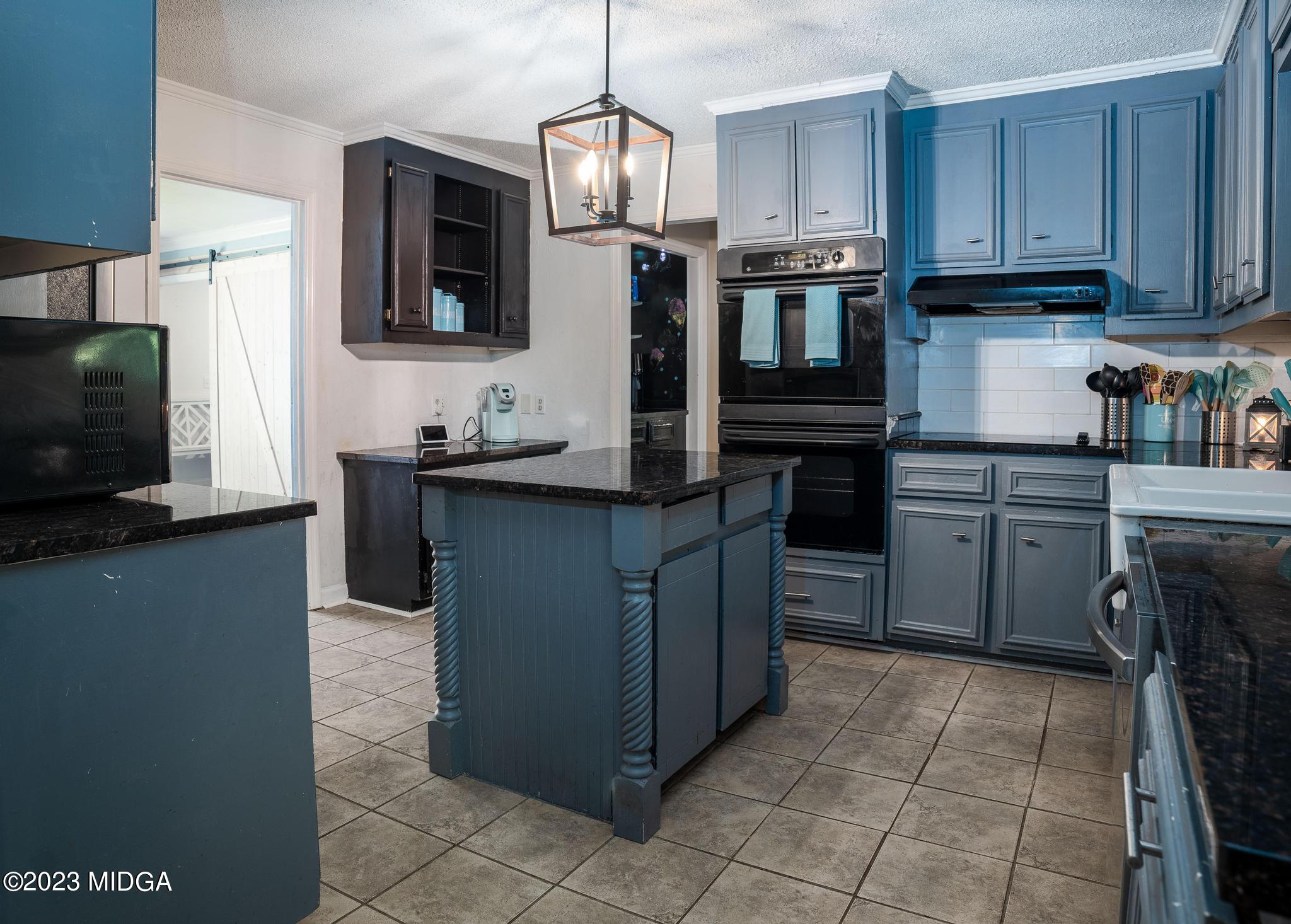 270 Castlegate Road Macon, GA 31210 - Photo 16 of 35 a kitchen with stainless steel appliances granite countertop a stove a sink and a microwave