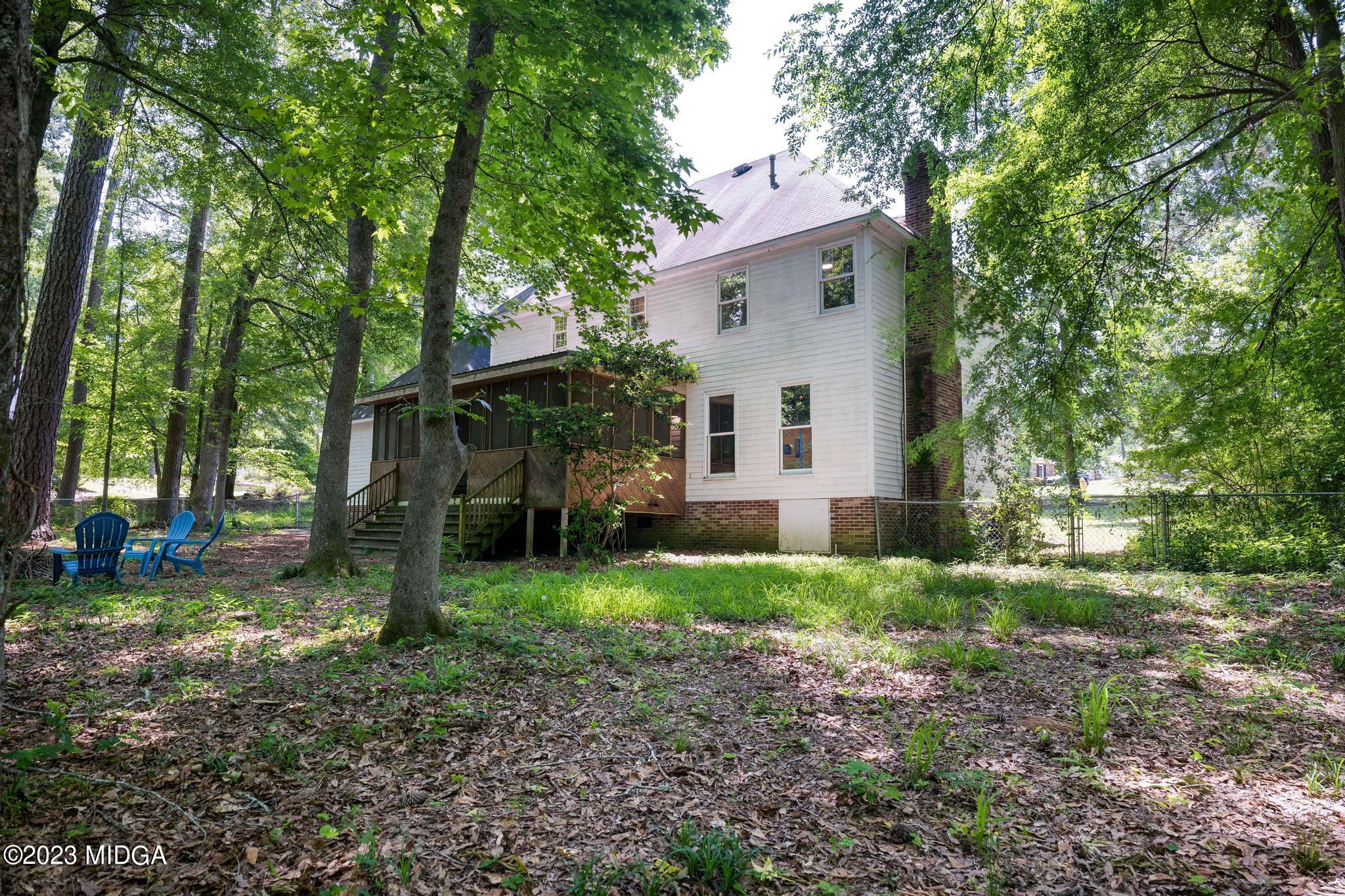 270 Castlegate Road Macon, GA 31210 - Photo 28 of 35 a view of a yard with a house and a large tree