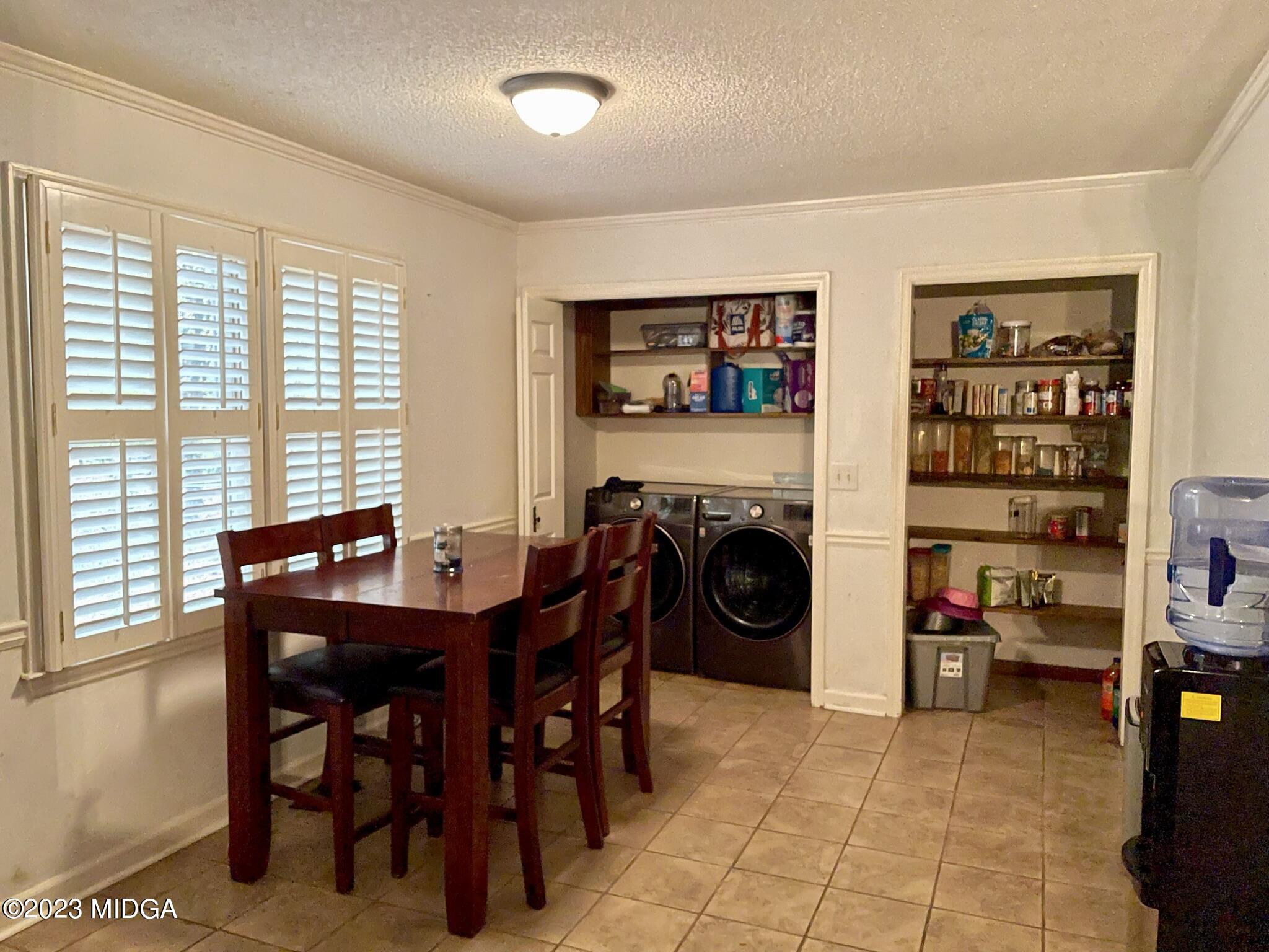 270 Castlegate Road Macon, GA 31210 - Photo 34 of 35 a view of a dining room with furniture and a fireplace