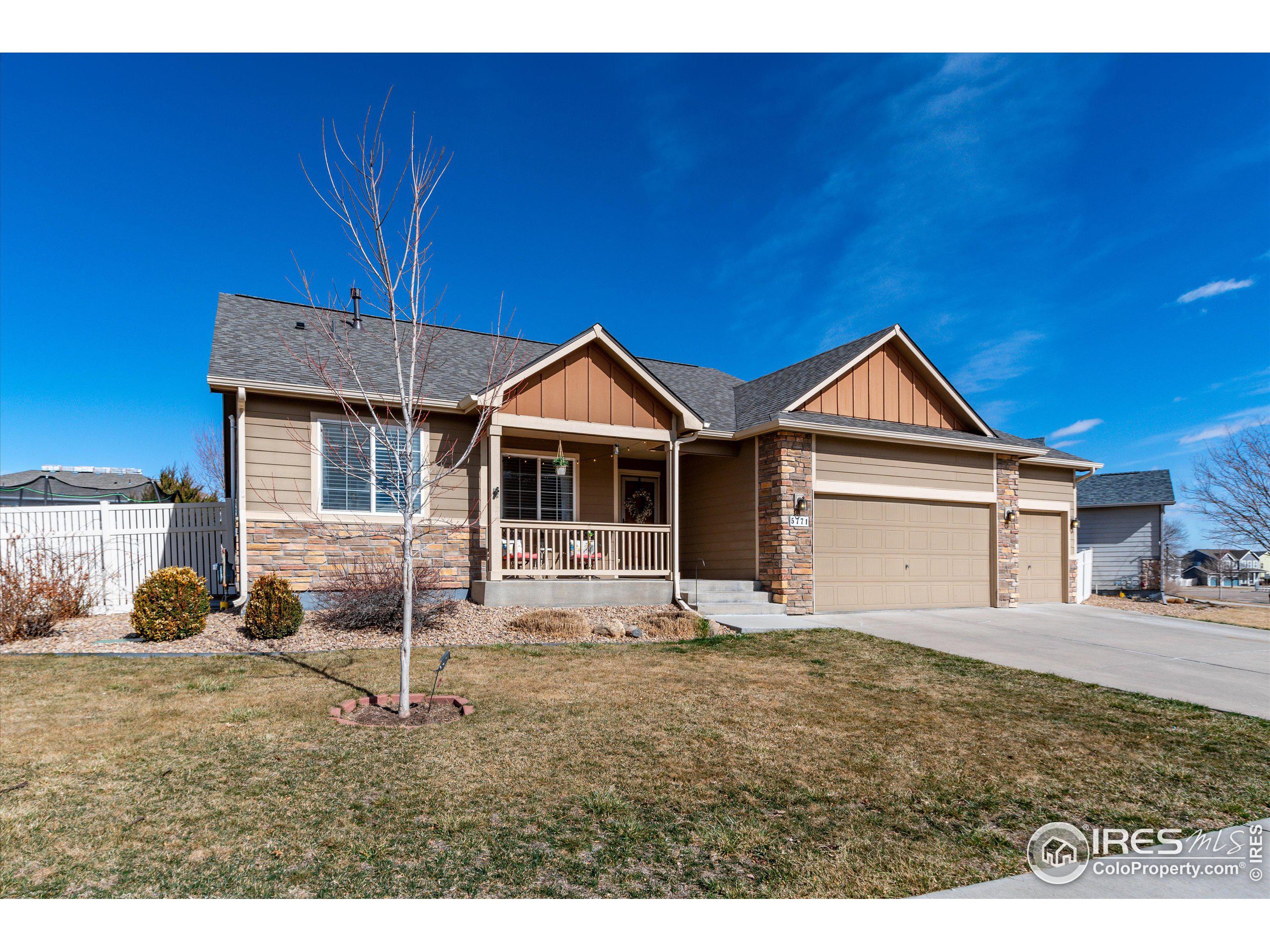 5771 Mountain Shadows Boulevard Firestone, CO 80504 - Photo 1 of 40 a view of a house with a yard