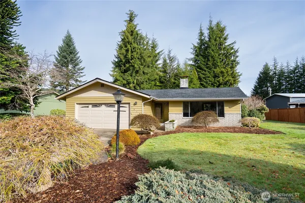a front view of a house with yard