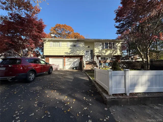 a view of a car park in front of the house